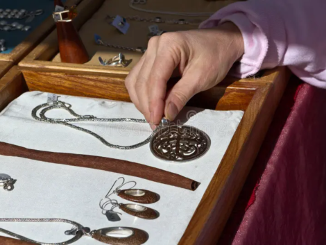may-i-see-holiday-shopping-examining-necklace-laid-out-showcase-box-crafts-fair-stand-artisan-jewelry-35553945.jpg